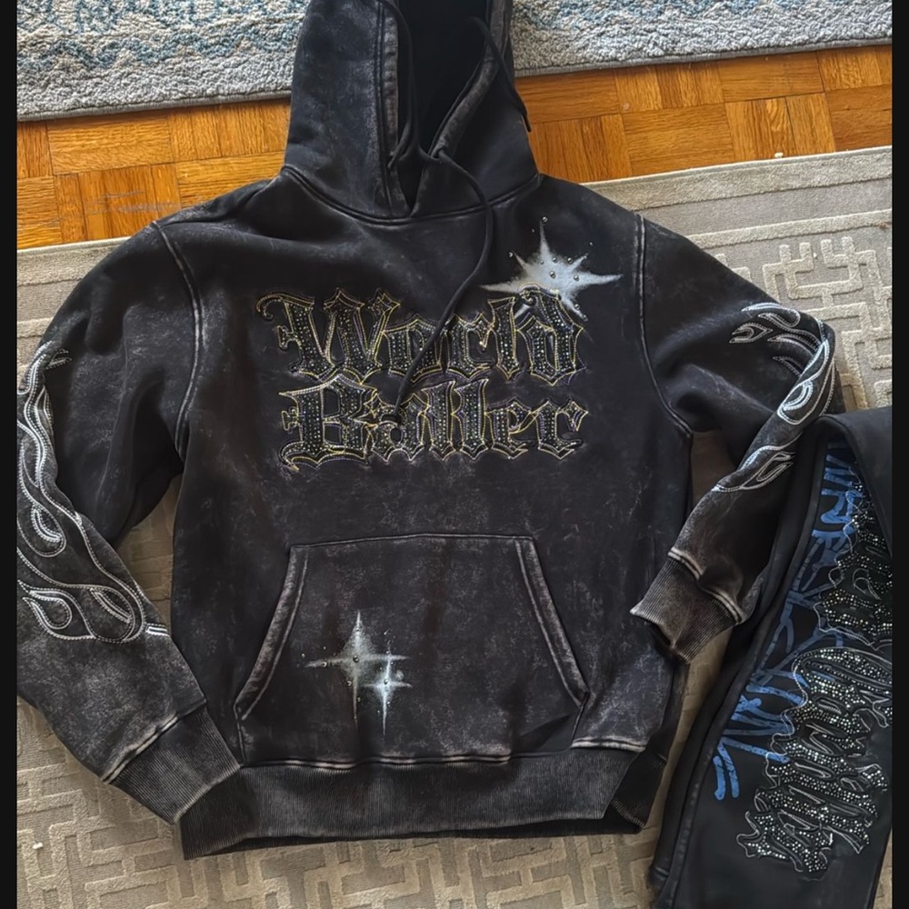 Edgy Black Hoodie with Graphic Text and Star Accents